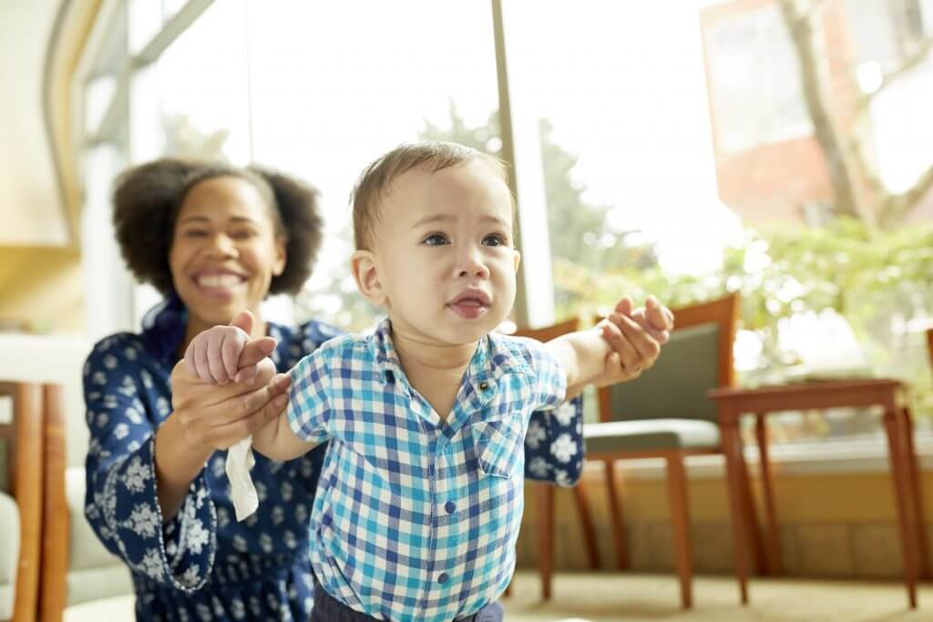 Mother and baby in doctors office waiting room